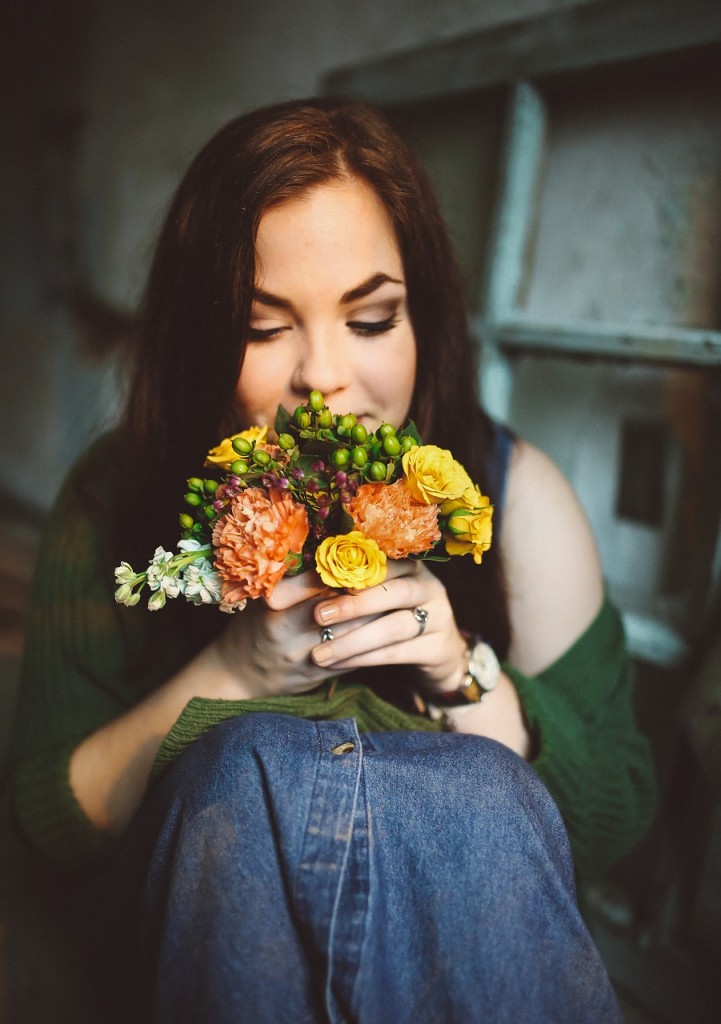 woman smelling flowers